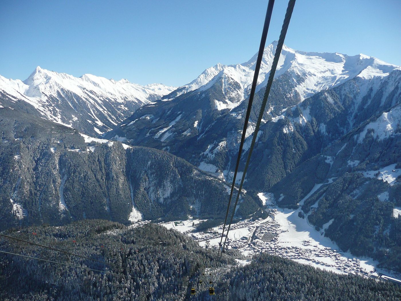 A winter view from the Penken cable car looking down over Mayrhofen and the snowy Zillertal ski area