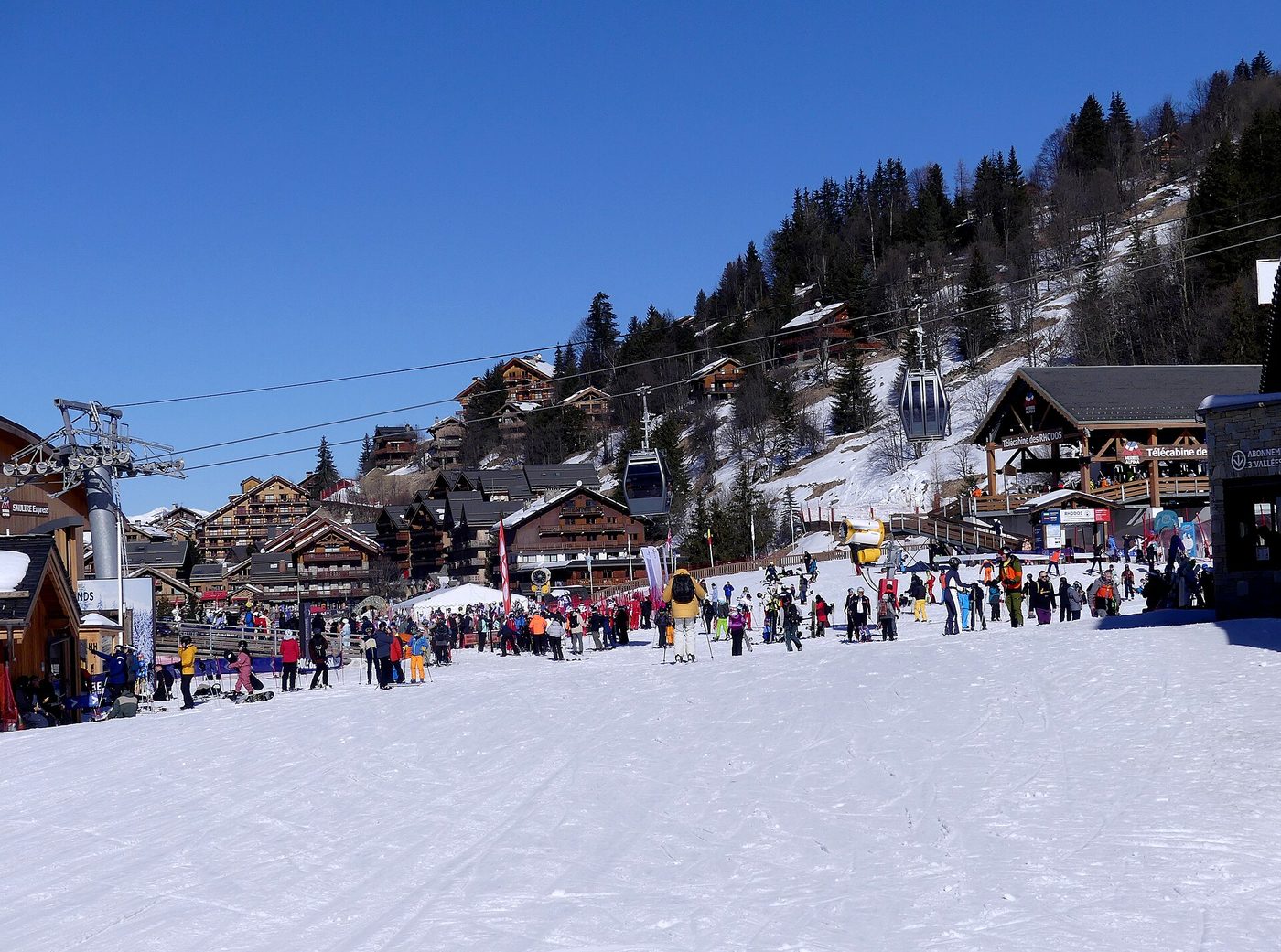 The Méribel-Centre resort base with chalet-style buildings, ski lifts and a busy ski front in winter