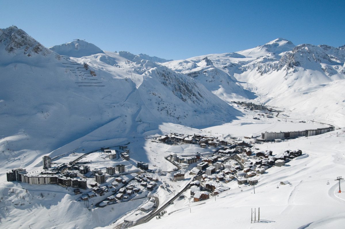 Panoramic view of the vast snowy ski terrain at Tignes with lifts and mountains in the background